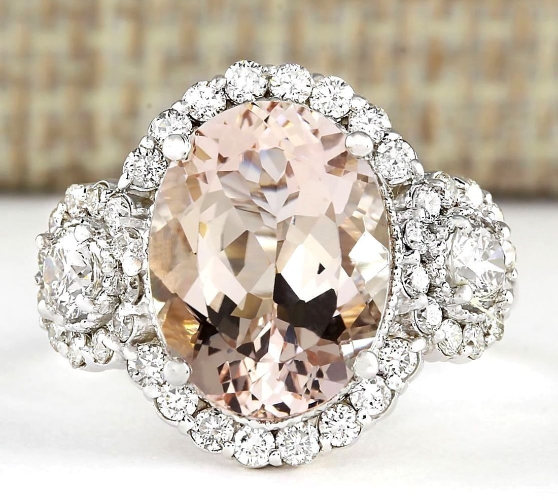 5.64 Carat Natural Morganite And Diamond Ring In 18K White Gold: 5.64 Carat Natural Morganite And Diamond Ring In 18K White Gold Stamped: 18K Ring Size: 6 Total Ring Weight: 6 Grams Diamond Weight: Total natural diamond weight is 1.25carat. VS2-SI1 clarity / G-H co