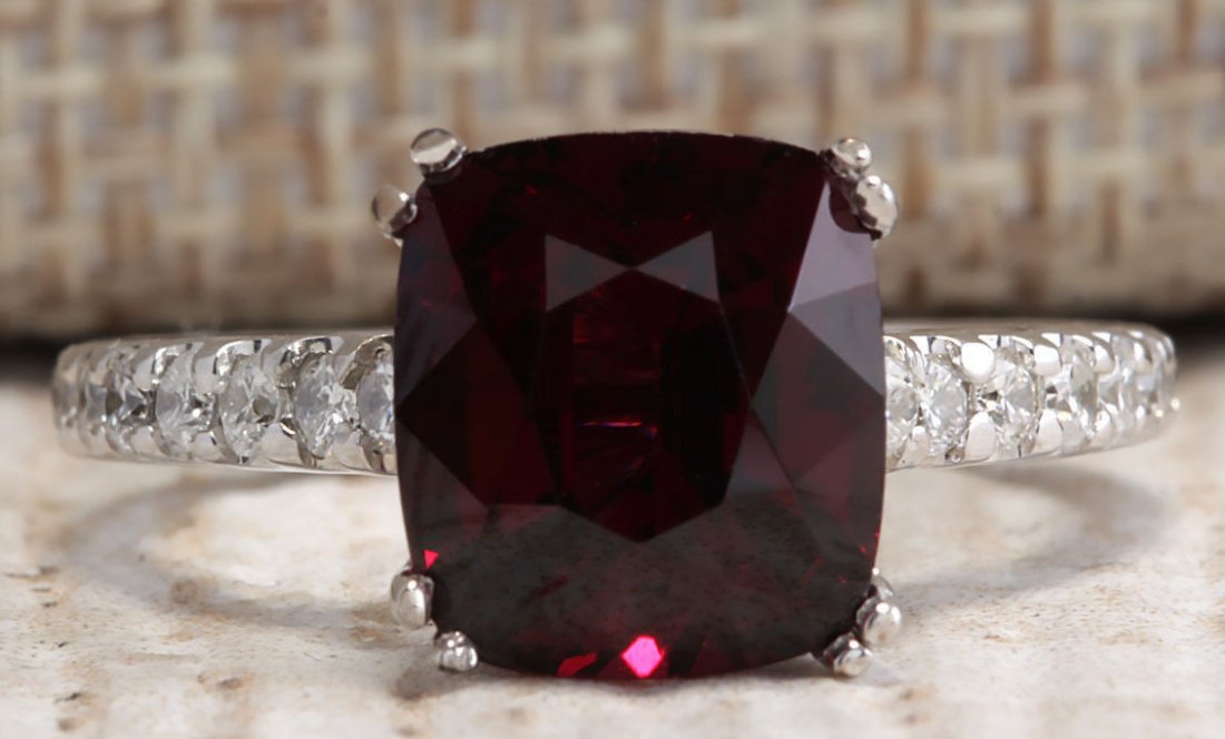 4.90Ct Natural Red Rhodolite Garnet And Diamond Ring: Stamped: 14K Ring Size: 6.25 Total Ring Weight: 3.6 Grams Diamond Weight: Total natural diamond weight is .50carat. SI1-SI2 clarity / G-H color Gemstone Weight: Total Natural Garnet Weight is 4.40ctw 