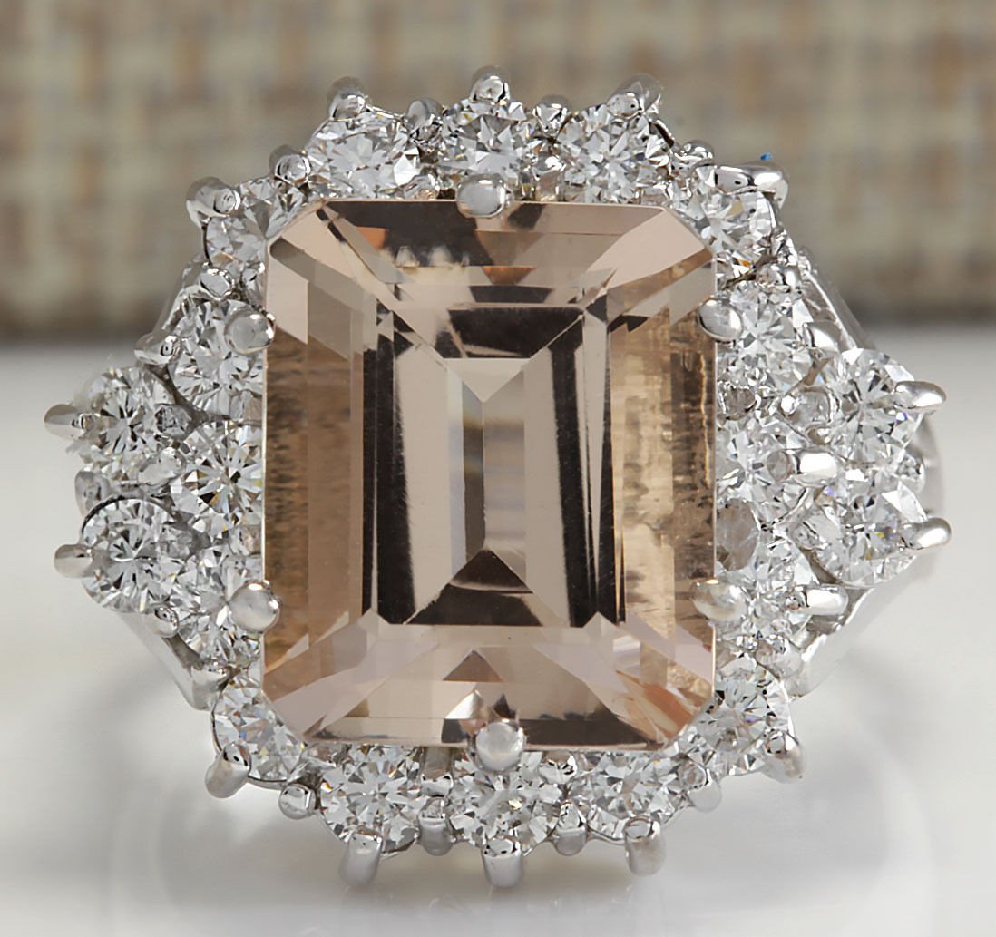 7.04CTW Natural Morganite And Diamond Ring 14K Solid: Stamped: 14K Ring Size: 6 Total Ring Weight: 7.5 Grams Diamond Weight: Total natural diamond weight is 1.35carat. SI1-SI2 clarity / G-H color Natural Morganite Weight is 5.69ctw (Measures: 11.94x9.89m