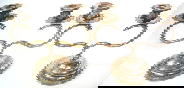 silver plated metal candelabras: Used pair of silver plated metal candelabras. 8" High & 9" Span