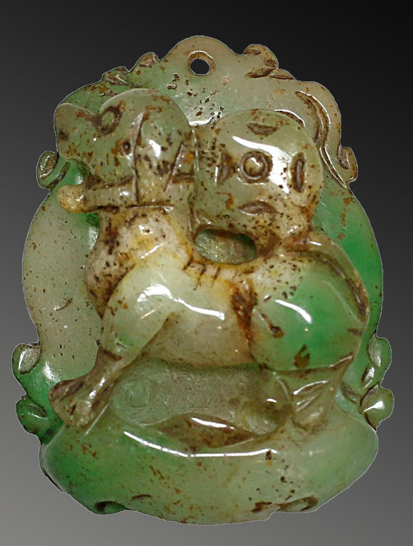 China carved green spinach jade pendant with Fu Dog. (1 of 2)
