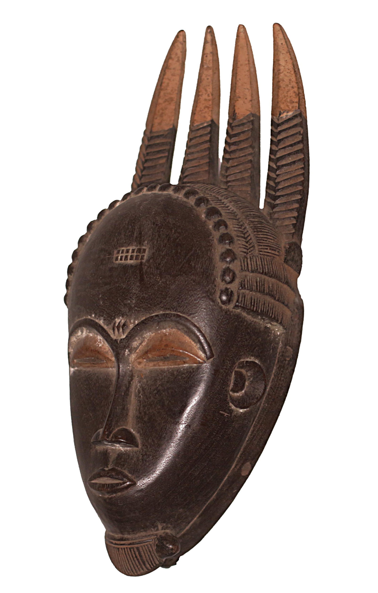 Ivory Coast Yaure people Female Mask Four wooden Horns: Ivory Coast. Yaure people Female Mask. Four wooden Horns on top 1970 circa. Traces of white pigmentation. 1075 gr. - 40x16x12 cm. Rare. Provenance Fall Elhadji. The Yohure inhabit the central region o