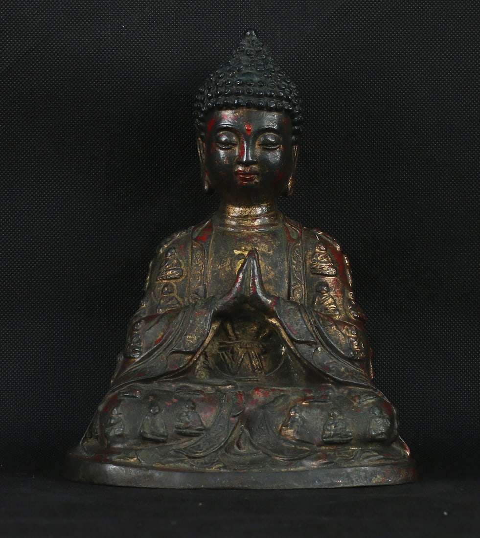 Tibet 1910 Old Bronze Buddha statue 21cm: Tibet. 1910 AD. Old Bronze Buddha statue with full decoration in front and backside, Tibetan Swastika symbol on front side. Traces of red and golden patina. Rare Buddha configuration. 1,2 kg. - 21x18x
