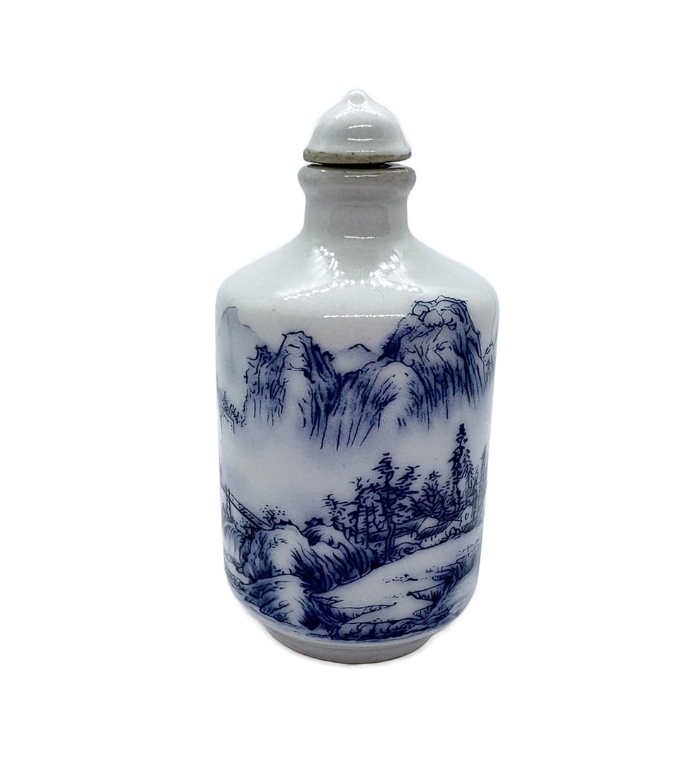 China 1950s Porcelain snuff bottle in Qing style: China. 1950s. Porcelain snuff bottle in Qing style (Qianlong style). Depicting a blue landscape. Marked on bottom. 60 gr. - 8x4x4 cm