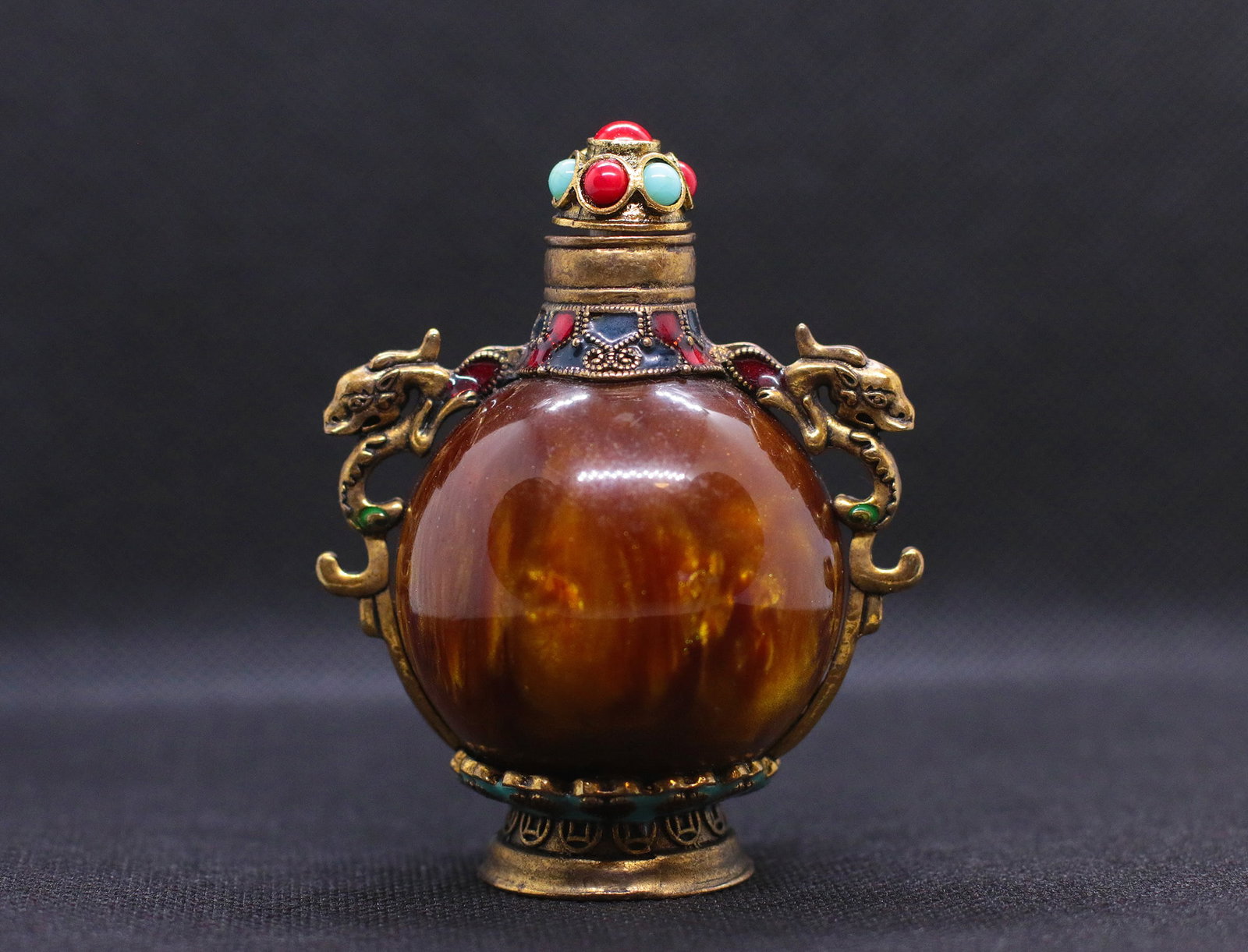 China 1960 AD Old chinese glass snuff bottle.: China. 1960 AD.Old chinese glass snuff bottle. Handmade pattern painted inside; decorated with brass dragons and hardstone on top. 146 gr. - 82x64x49 mm.