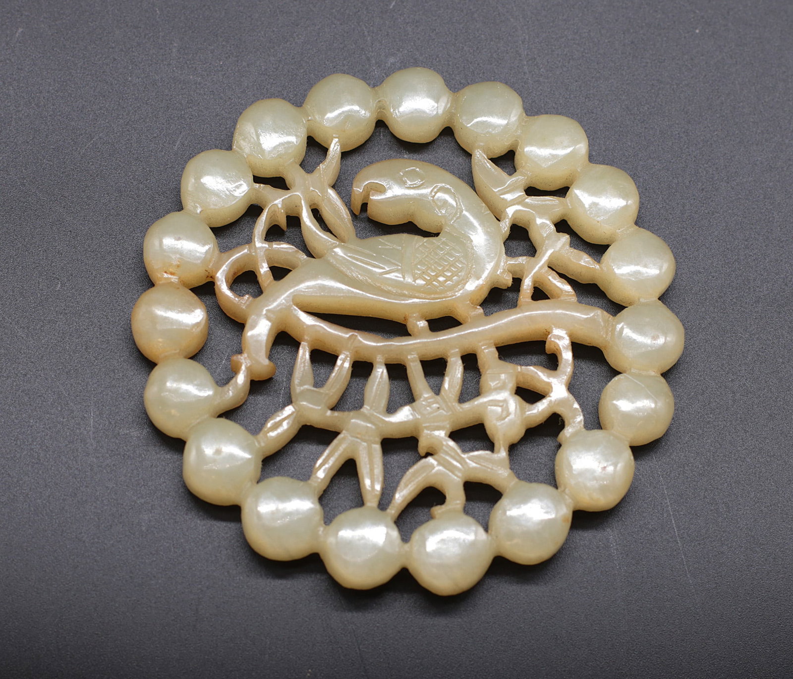 China MinGuo Jade pendant in round shape: China. MinGuo period. Jade pendant in round shape with bird. 30 gr. - D: 6,5 cm