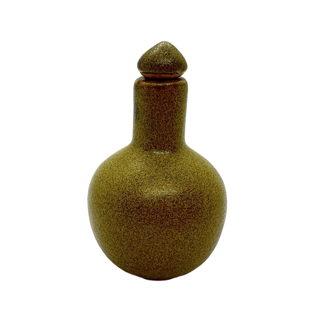 China 1960/1970s Porcelain snuff bottle: China. 1960/1970s. Porcelain snuff bottle. Dark yellow\ochre color. 60 gr. - 7,9x4,7x4,7 cm