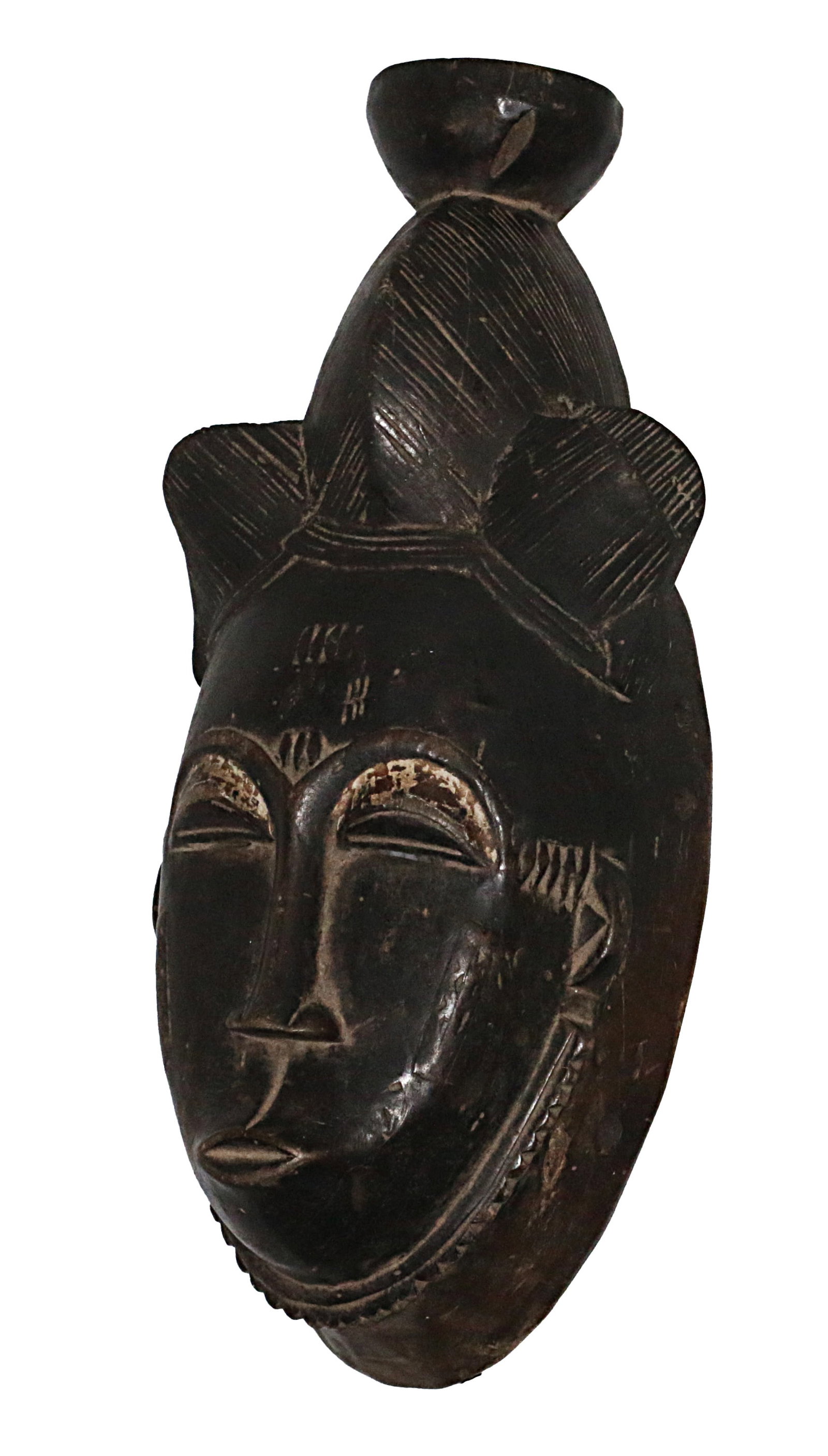 Ivory Coast Baule people Ceremonial mask Traces of pigmentation 1970: Ivory Coast Baule people. Ceremonial mask. Traces of pigmentation. 1970 circa. 700 gr. - 36x16x10 cm. Extremely fine. Rare. Provenance Fall Elhadji. The Baule are one of the Akan peoples. They moved w