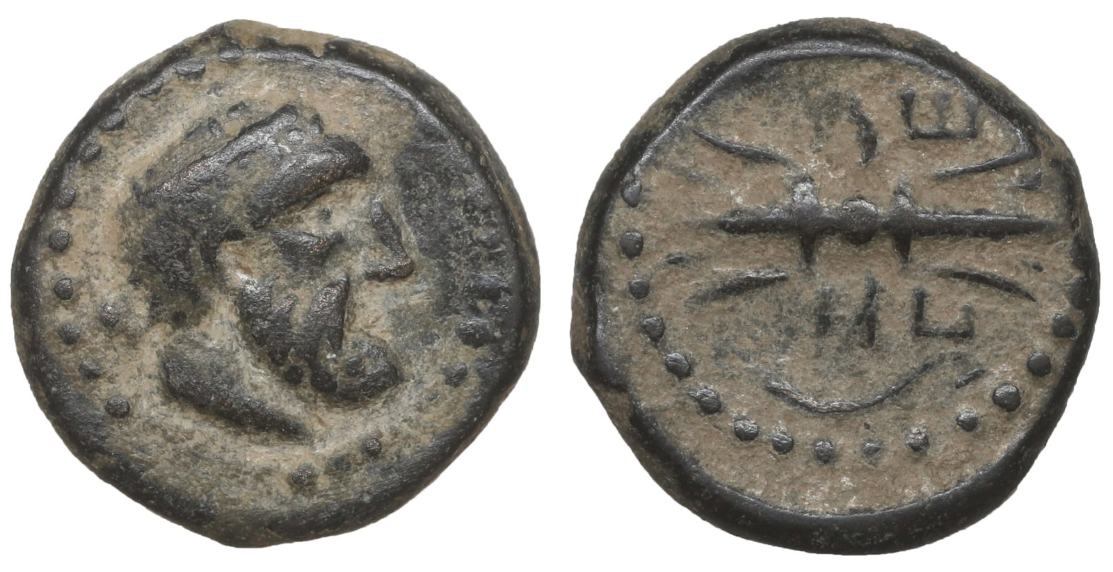 PISIDIA Selge 2nd-1st century BC Bronze: PISIDIA. Selge. 2nd-1st century BC. Bronze. 2.75 gr. – 12.8 mm. Bare head of Herakles to right; before, K. Rev. C???? Winged thunderbolt; to right, bow topped with a griffin head. SNG BN 1998 (same