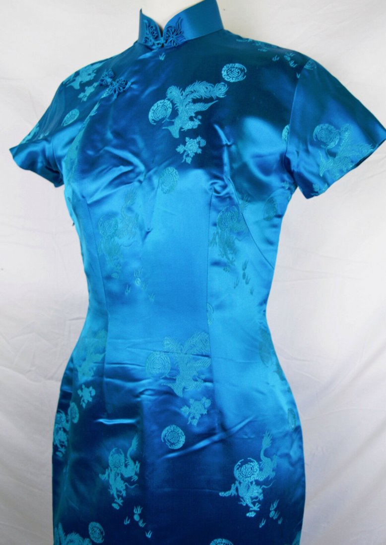 Vintage 50s Blue Asian Cheongsam Dragon Mandarin Collar: In very good preowned condition, bodice has 2 small stains at the bust area Back darts have been let out. Label says "handmade in Hong Kong" Bust 36, waist 29, hip 36.5. Zero buyer premium on all lots