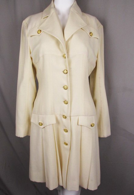 A Cream Karl Lagerfeld Miliary Style Dress: Vintage cream wool Karl Lagerfeld Dress with pleated skirt. Size 40. Bust 36, waist 31, Hip 44, Sleeve 22, Length 35. Shipping for this lot is $12.00 USA, $40.00 International. We combine shipping on 