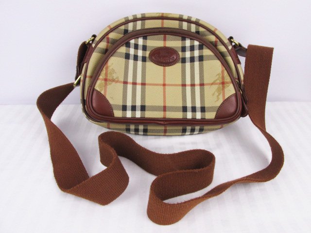 Burberry Nova Plaid Cross Body Shoulder Bag: Measures 9.5 wide by 7 tall. Shipping for this lot is $18.00 USA, $40.00 International. We combine shipping on multiple lots. ZERO% BUYERS PREMIUM ON ALL LOTS!Payment is due within 7 days of invoice o