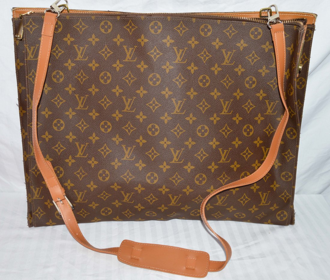 Vintage Louis Vuitton Slim Travel Bag: Circa 1970s, comes w Key & Strap. Measures 18 x 14. Probably part of a luggage set. Shipping for this lot is $15.00 USA, $40.00 International. We combine shipping on multiple lots. ZERO% BUYERS PREMIU