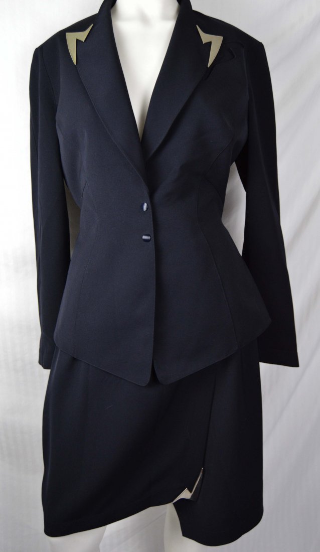 Thierry Mugler Skirt Suit Wingtip Collar: USA Shipping only on this lot. Size 42 Jacket, skirt 40. Black twill, shaped lapel with silvertone trim, matching wrap skirt with metal trim at hem corner. Labeled. B-38, jacket L-27, W-28, H-38, skir