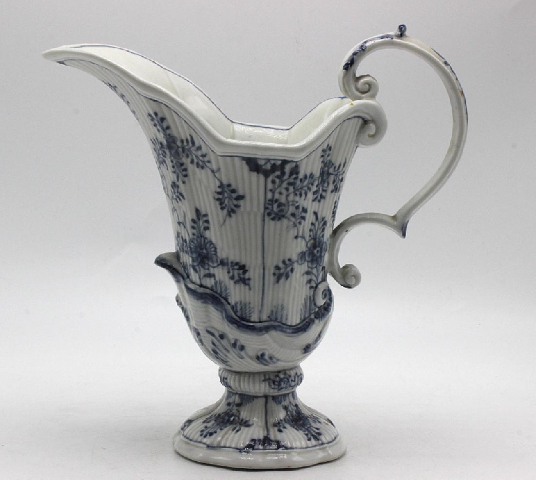 Antique Blue & White Helmet Shaped Cream Jug Bearing: Antique Blue & White Helmet Shaped Cream Jug Bearing Cross Swords Mark. 7 1/4" high x 7 3/4" wide.