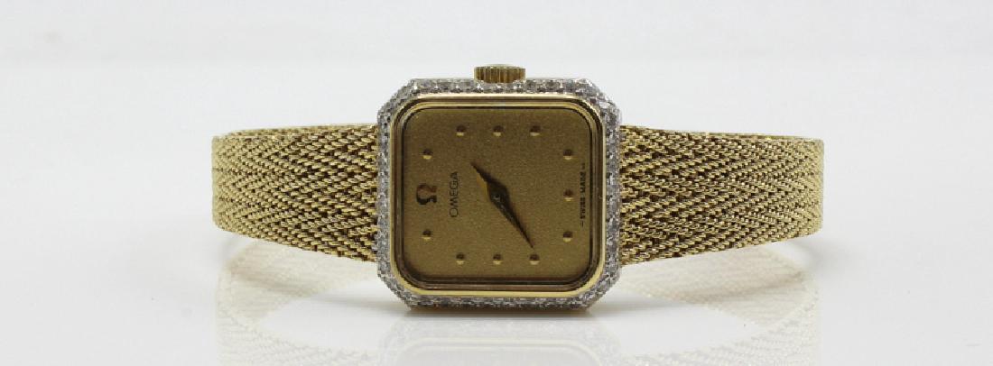 14Kt YG Ladies Omega with Diamond Bezel: 14Kt YG Ladies Omega with Diamond Bezel. 18.2 dwt.