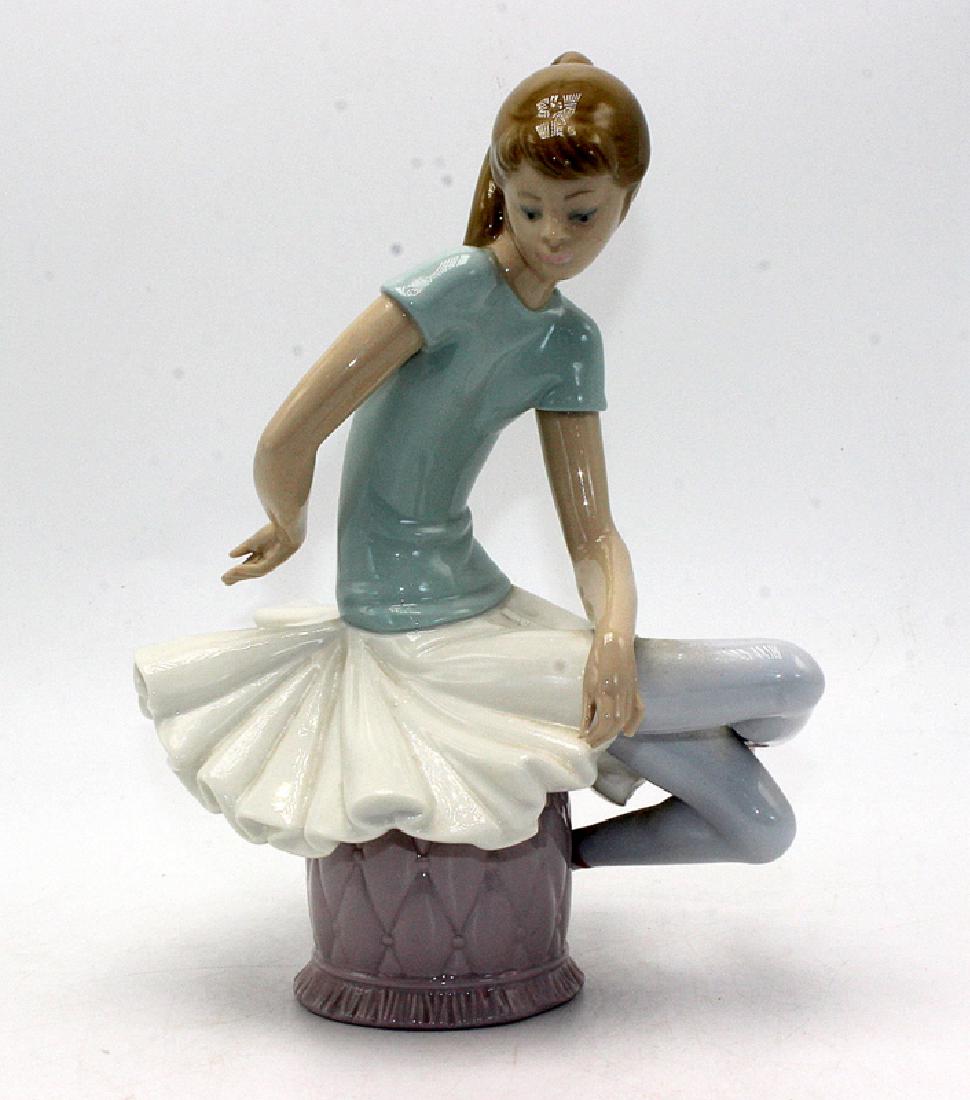 Lladro Sitting Ballerina Girl Figurine: Lladro Sitting Ballerina Girl Figurine. Handmade in Spain. 8 1/2" high x 6" wide.