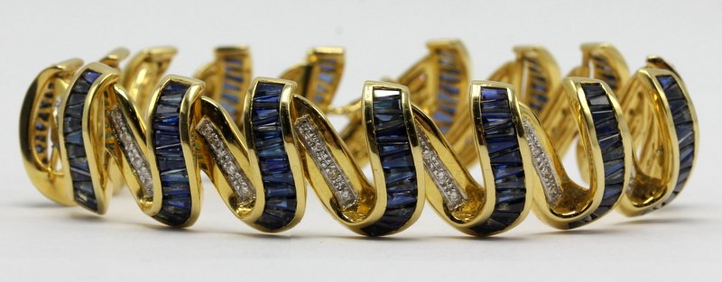 Contemporary Yellow Gold Sapphire and Diamond Ribbon Br (1 of 1)