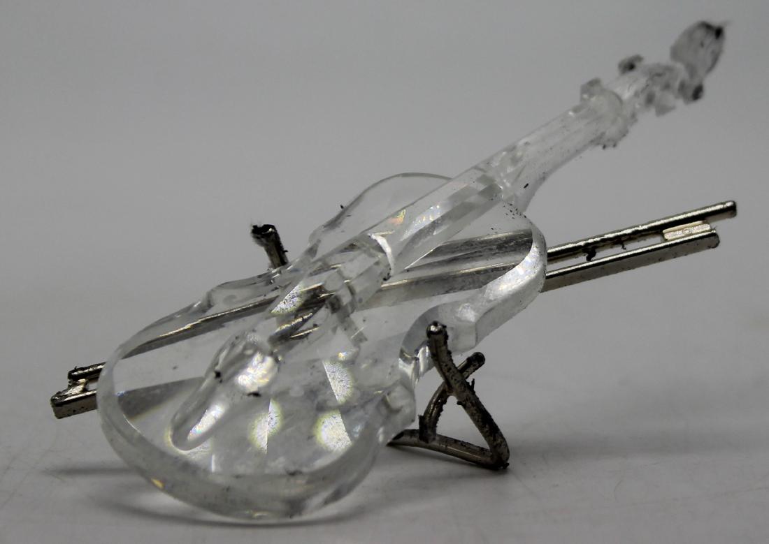 Swarovski Crystal Violin: Swarovski Crystal Violin figurine with stand. The piece is 4" in length.