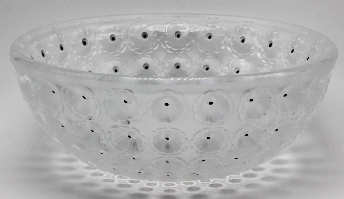Lalique crystal bowl: Designed in 1929 by RenÃ© Lalique in clear glass, the Nemours bowl is a magnified evocation of the poppy flower where the town of Nemours has made poppy candy its specialty. Highlighted with 240 han