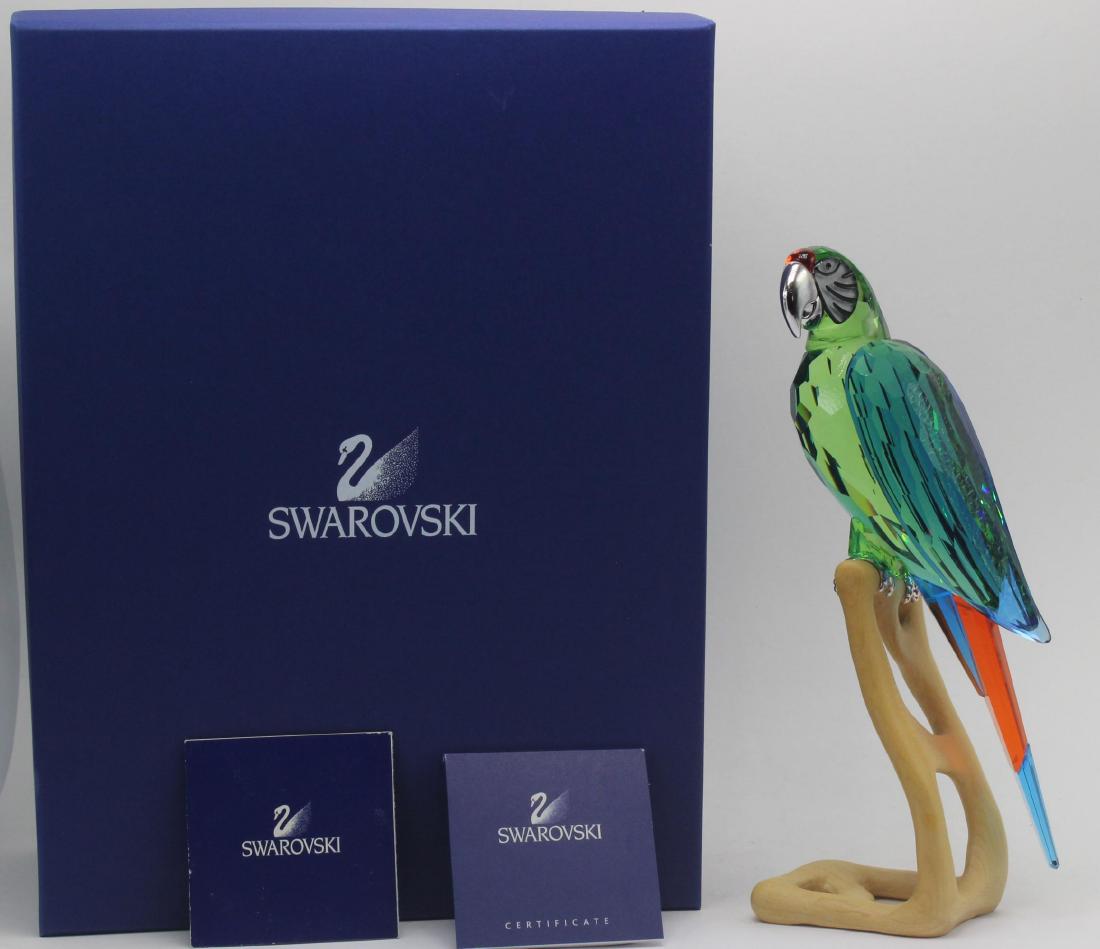 Swarovski crystal paradise macaw: Swarovski crystal paradise macaw in wood, with original box. 9" High. Retails for $885