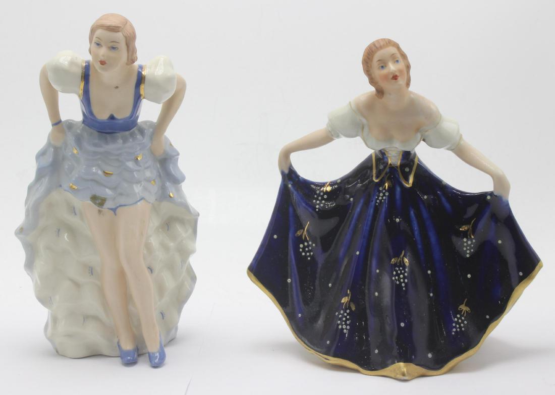 Pair of royal dux ladies porcelain figureins: Pair of royal dux ladies porcelain figureins. 7 1/4"H x 8"H.