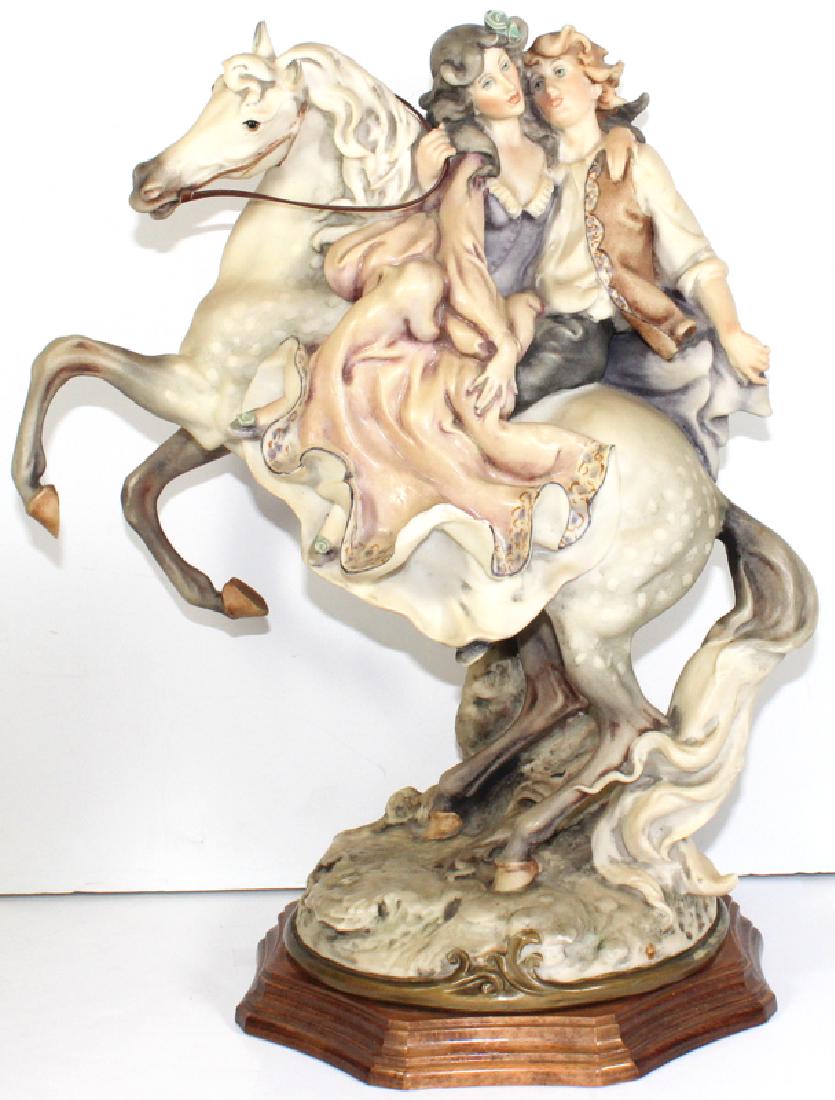 Giuseppe Armani Porcelain Couple on Horse Figurines: Giuseppe Armani Porcelain Couple on Horse Figurines. Measures - 15.5" h x 11" long, has a chip, as is.