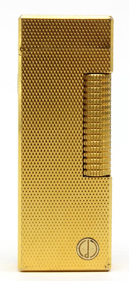 Dunhill gold plated swiss lighter: Dunhill swiss made gold plated lighter measures 2 1/2" H