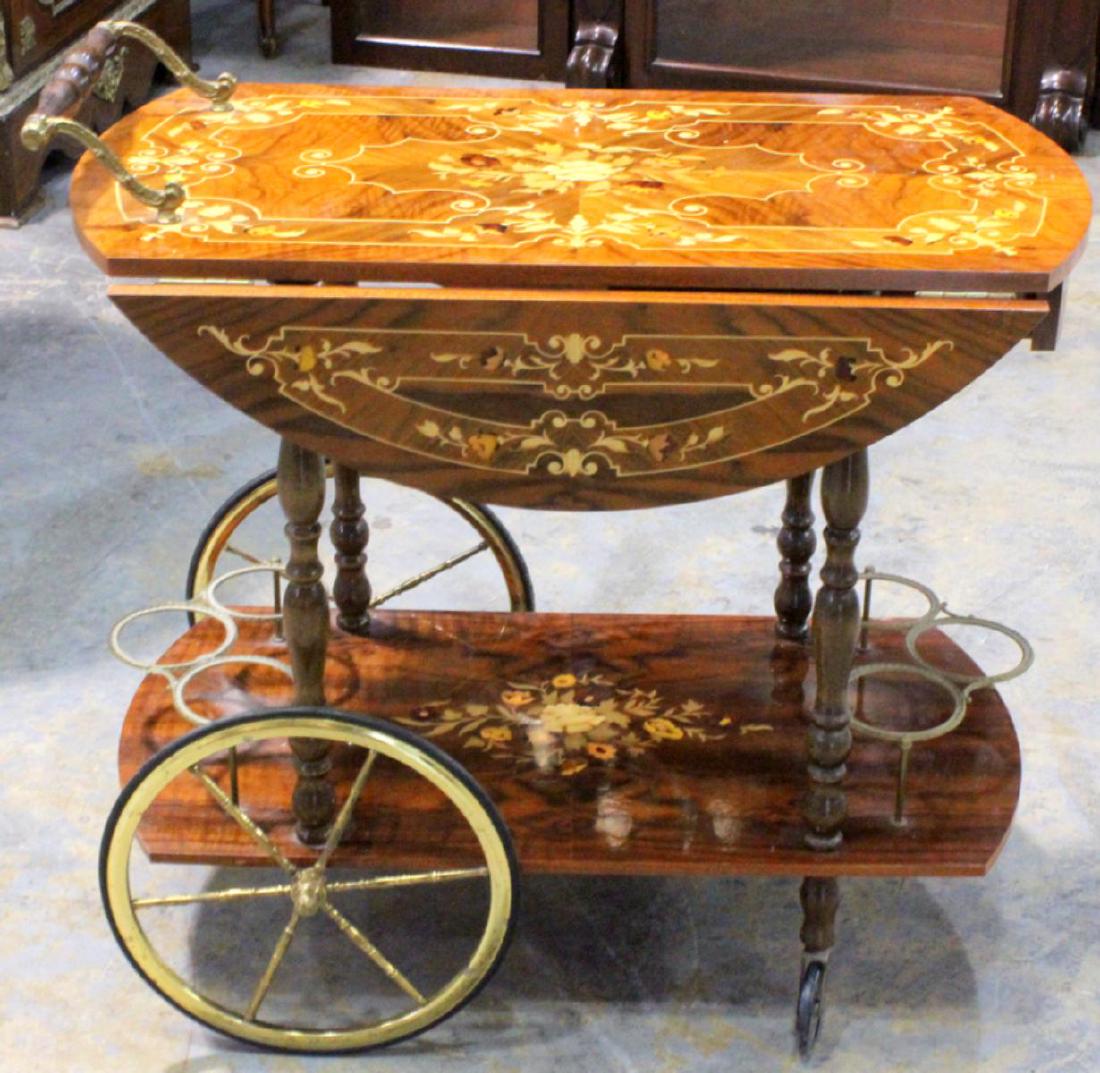 Italian inlaid leaf cart: Inlaid leaf tea cart measures 29" H x 30" L x 29" W