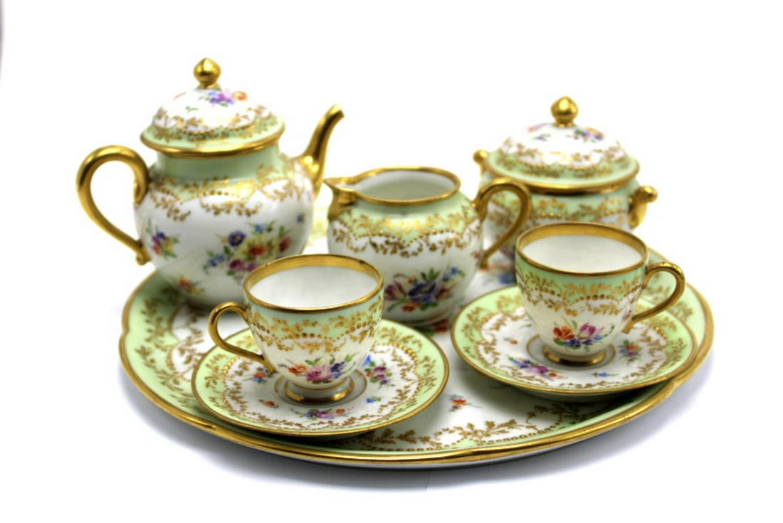 Eight Piece Dresden RK Germany Porcelain Tea Set: Dresden RK germany porcelain tea set of 8 pcs includes creamer measures 2 1/4" high + teapot measures 4" high + sugar bowl measures 4" high + two cups measures 1 5/8" high + two saucers measures 3 1/2