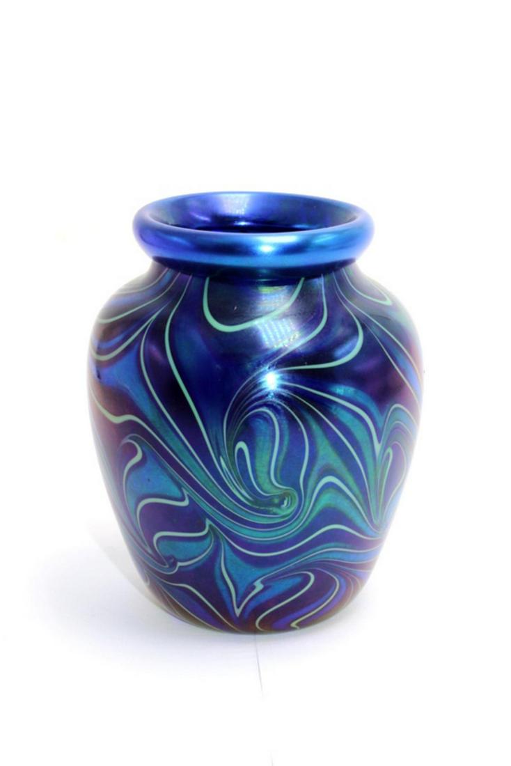 Small Orient & Flume Blue Art Glass Vase: Small orient & flume blue iridescent art glass vase signed on bottom meaures 4 3/4" High