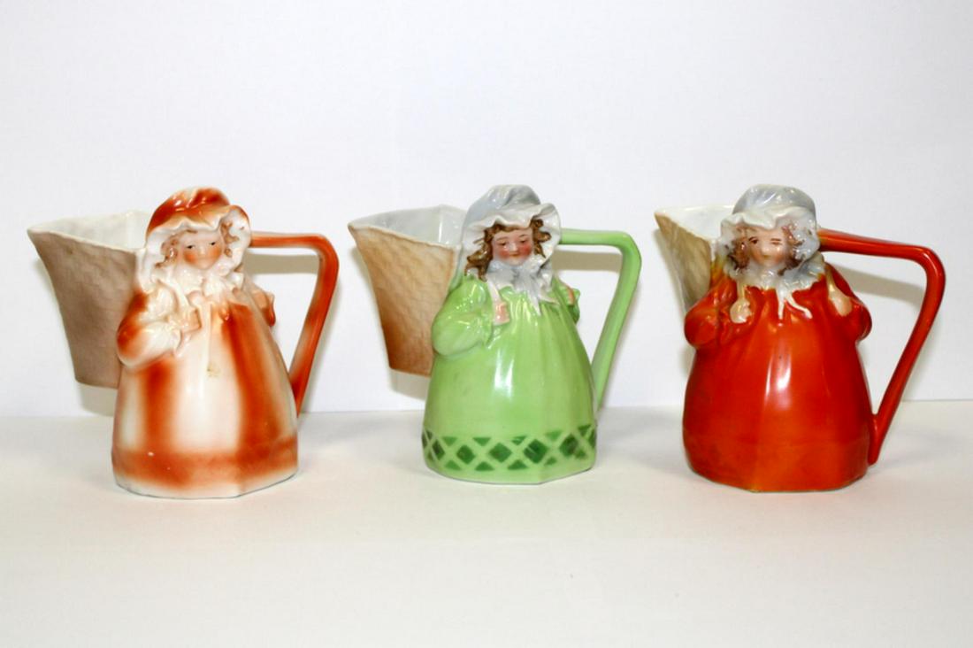 3 Pcs Royal Bayreuth Girl with Basket & Dress Creamers: 3 pcs royal bayreuth girl with basket & dress creamers measures 4" H