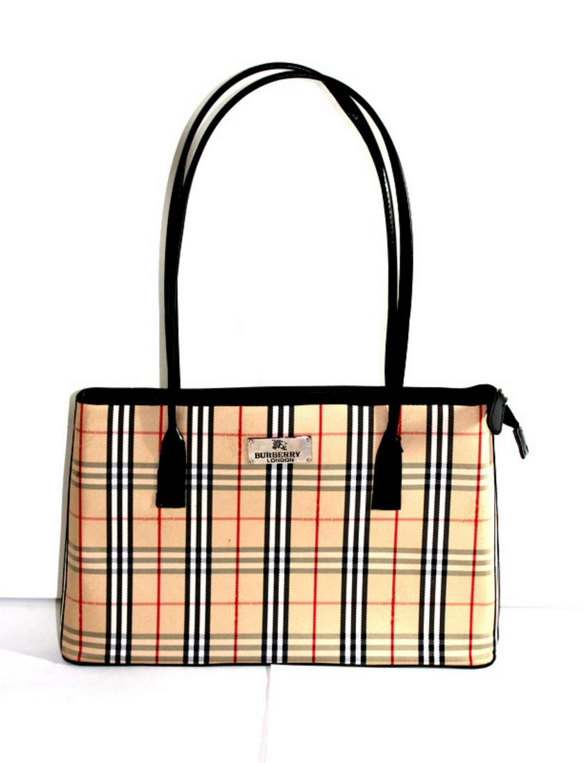 Burberry London Handbag: Burberry london handbag measures 19" x 3"