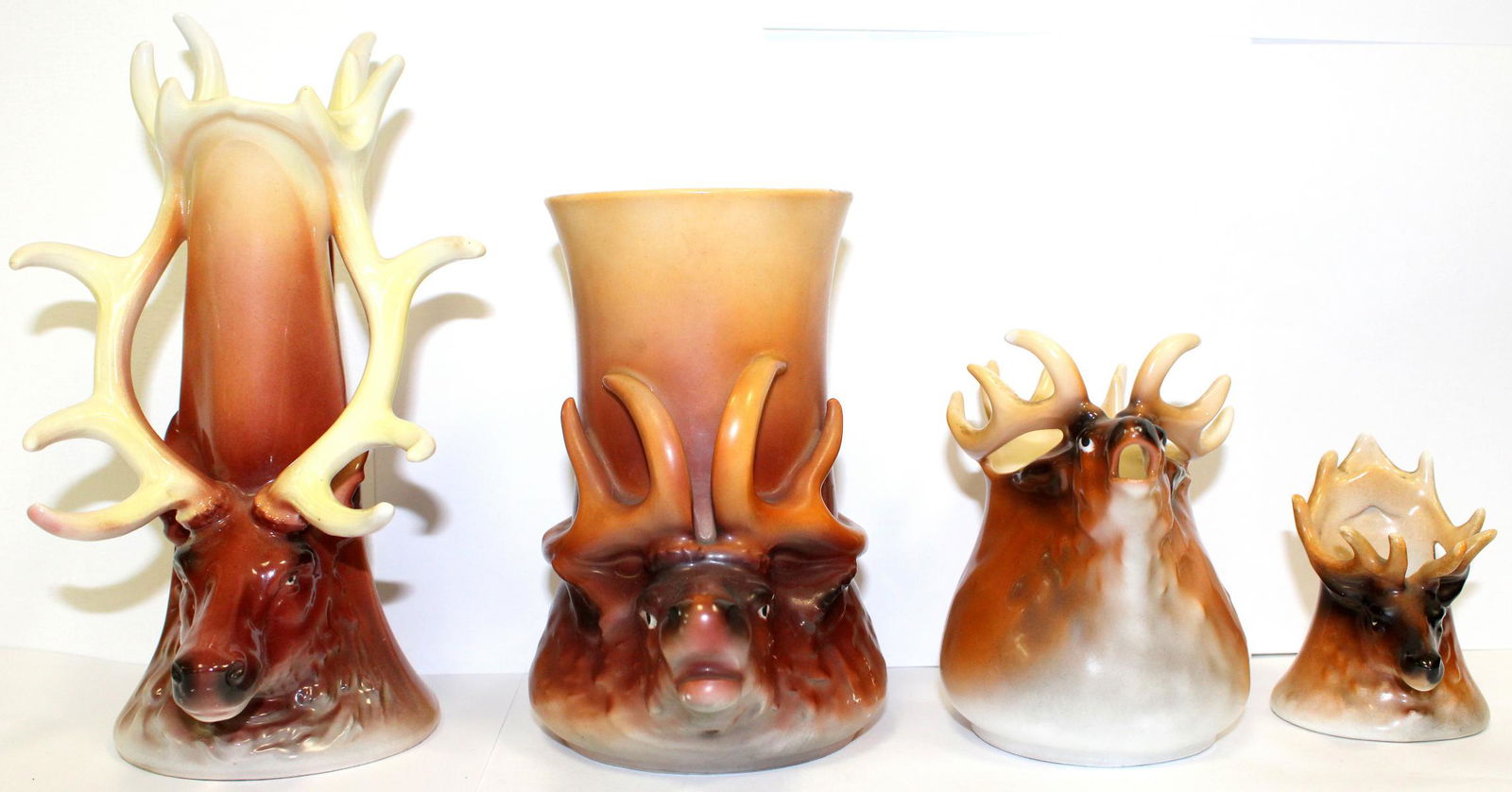 4 Pcs Royal Bayreuth Elk Set: 4 pcs royal bayreuth elk set includes toothpick holder measures 3" H, creamer measures 4 1/2" H, beer stein measures 6" H & handled candlestick holder measures 8" H