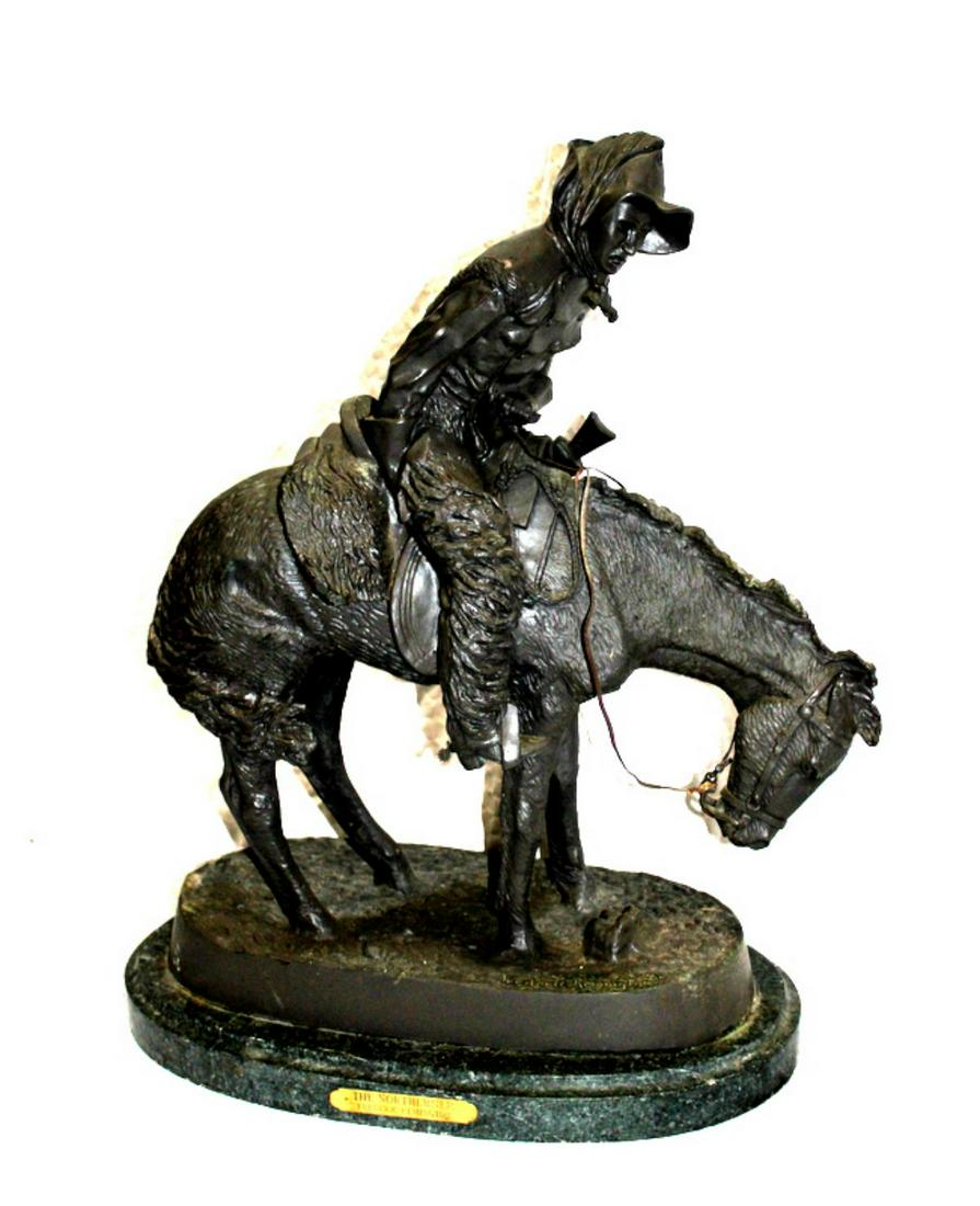 After Frederic Remington American Bronze Sculpture: After Frederic Remington (American, 1861-1909) the northern bronze sculpture on green marble base measures 24" x 17"