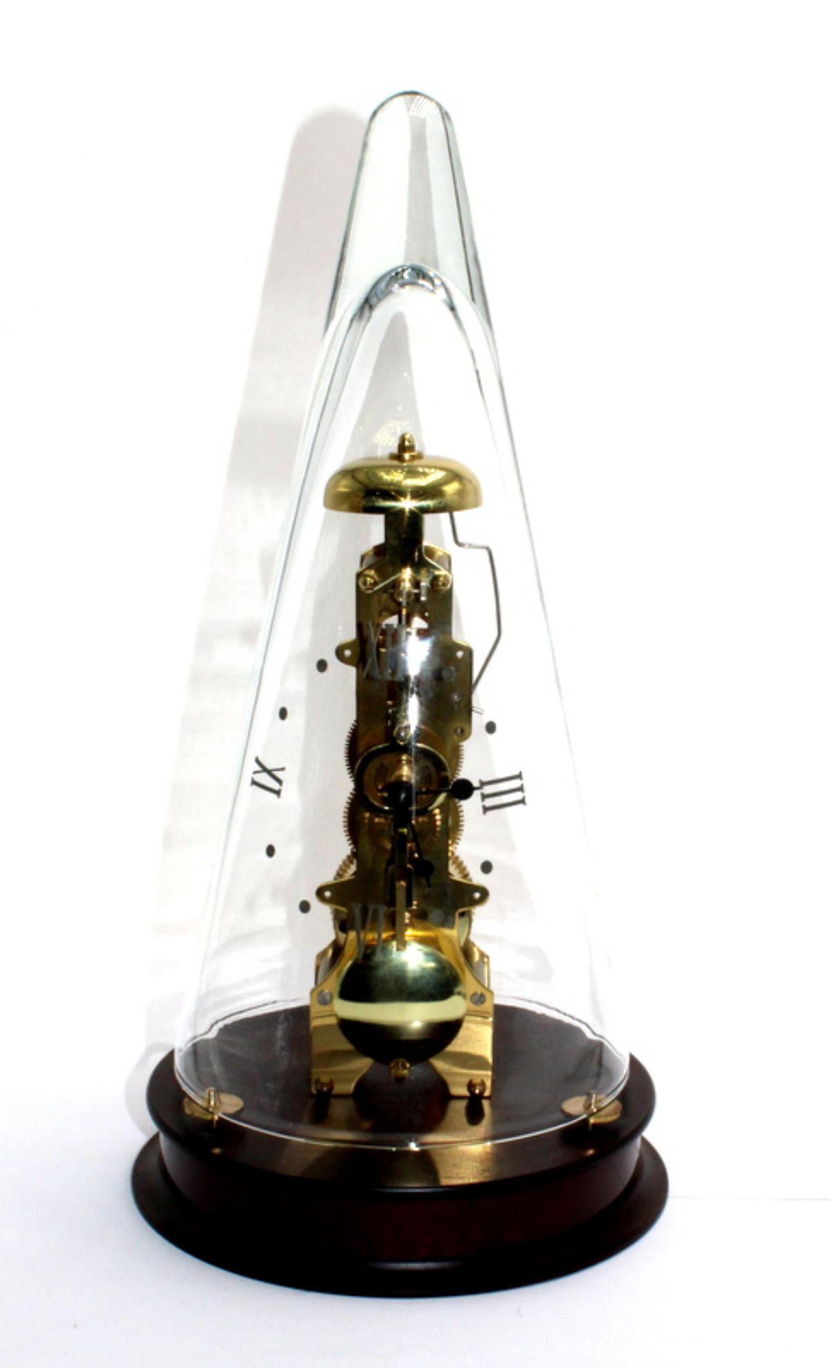 Franz Hermle Skeleton Clock: German Franz Hermle skeleton clock housed under glass cone with wood base, marked Franz Hermle 791-081 on the back measures 14" H