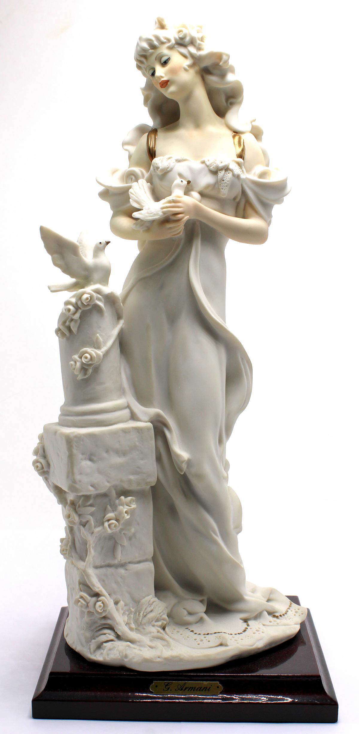 Guiseppe Armani Florence Lady With Dove Figurines: Guiseppe Armani Florence lady with dive figurines measures 12 3/4" High