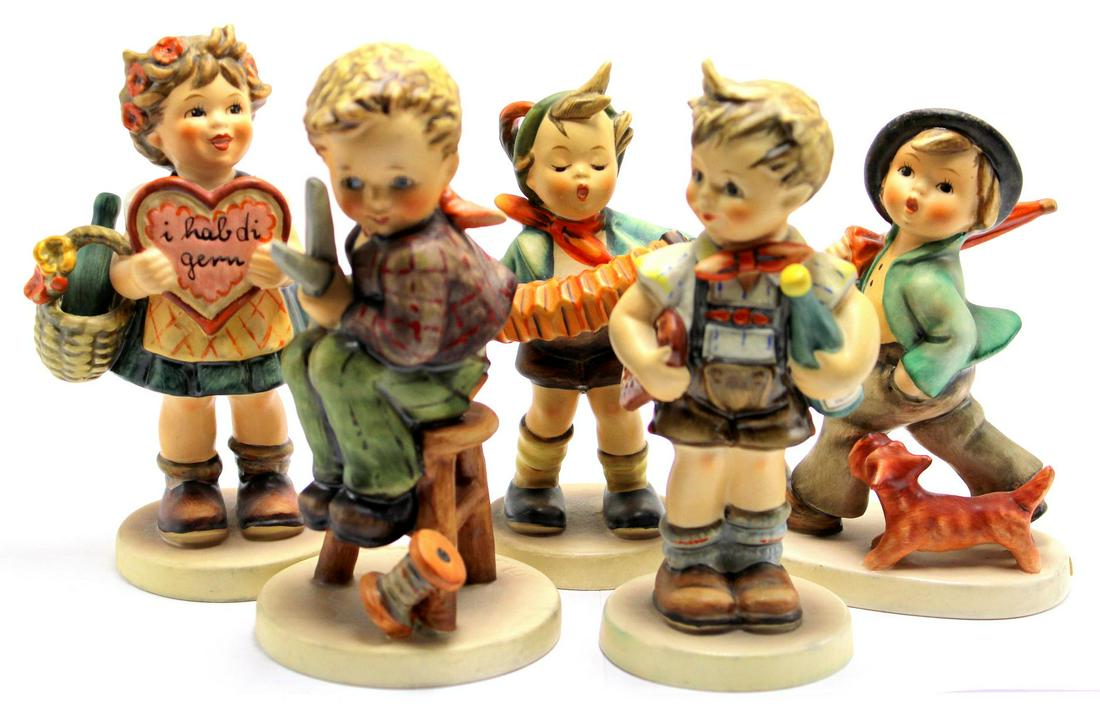 Five Goebel Hummel Figurines: Five Goebel Hummel figurines includes little tailor #308, valentine gift #387, accordion boy #185, valentine joy #399, boy with dog and umbrella