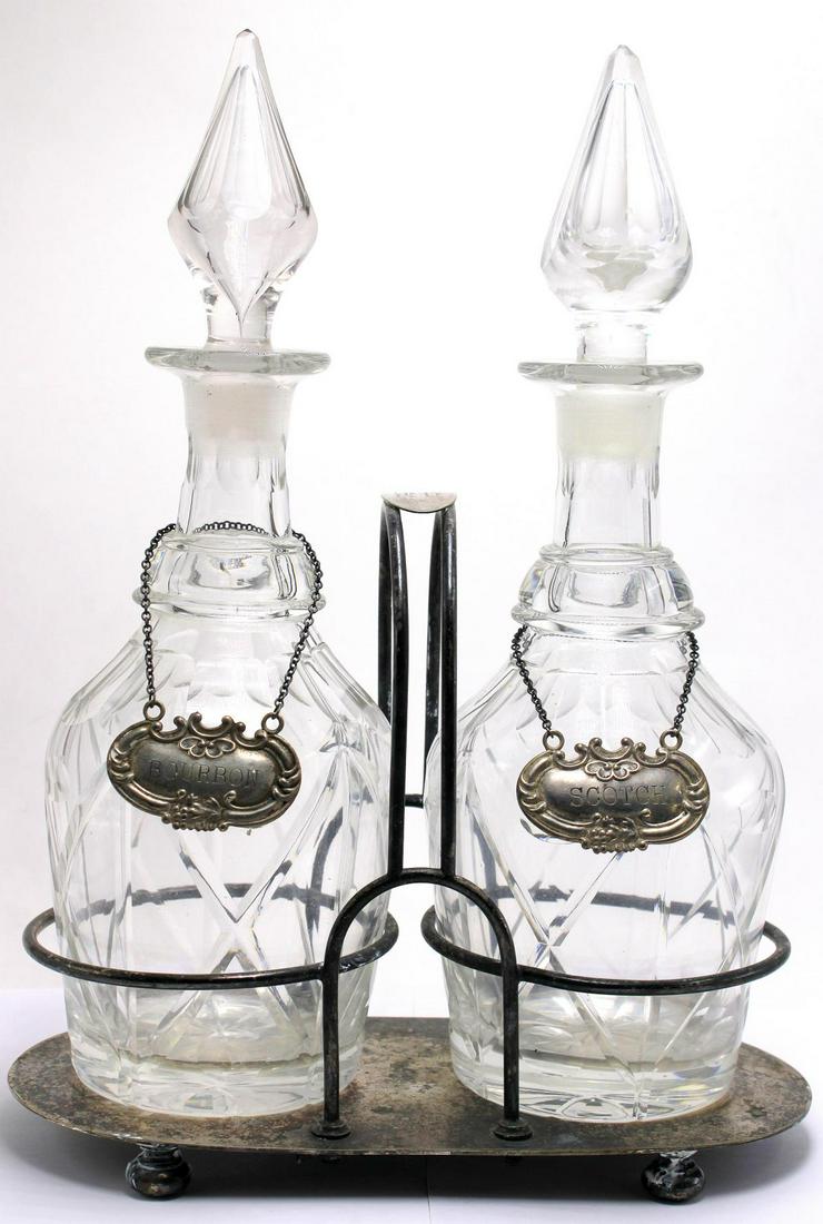 Walker and Hall Silver Plate and Crystal Decanter Set: Walker and Hall silver plate and crystal decanter set of two cut crystal decanter with sterling silver liquor labels measures 12" High