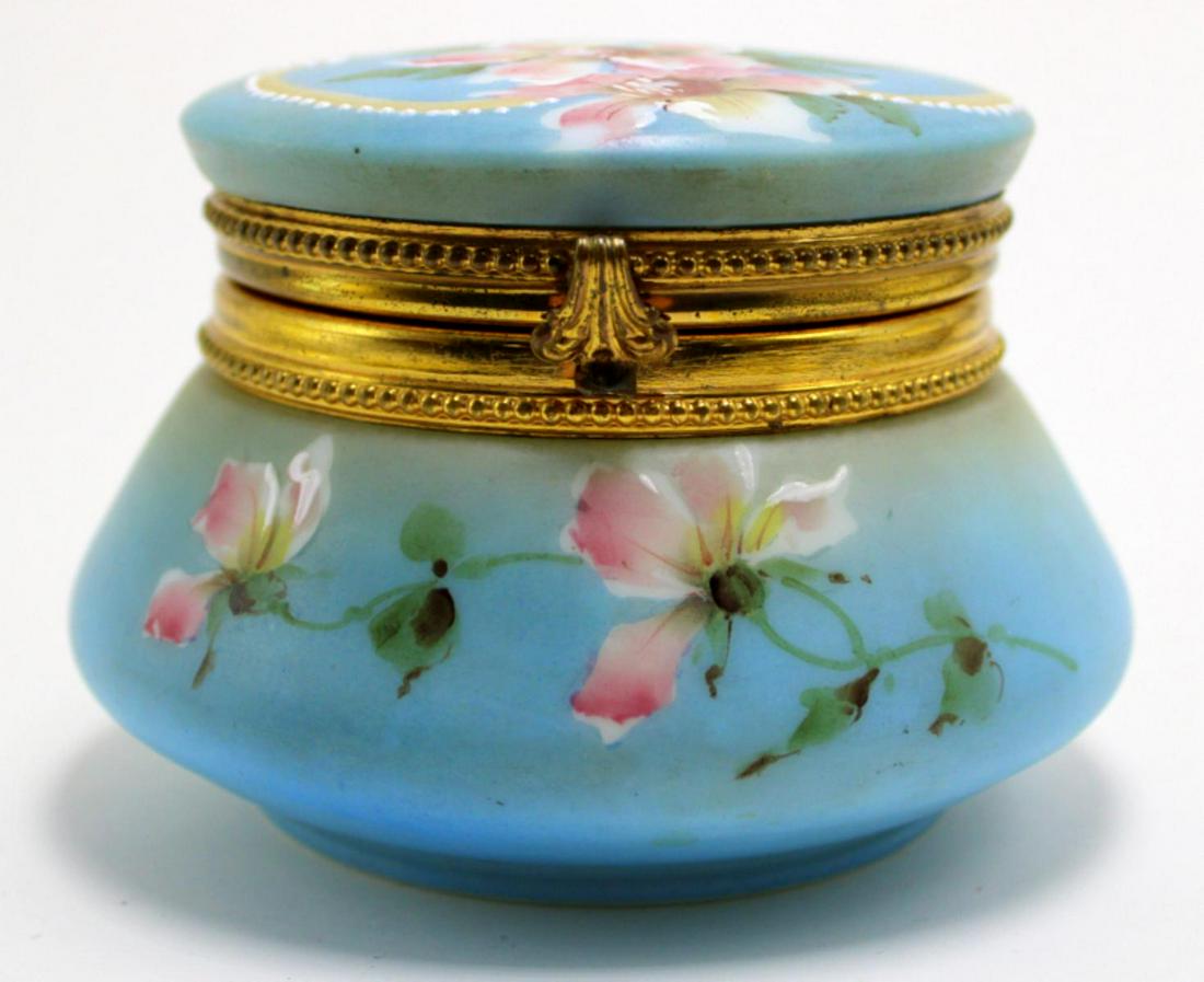 Nakara C.F. Monroe Blue and Pink Hinged Jewel Box: Nakara C.F. Monroe hinged blue and pink tones with floral decorated and enamel beaded jewel box measures 3 1/2" High