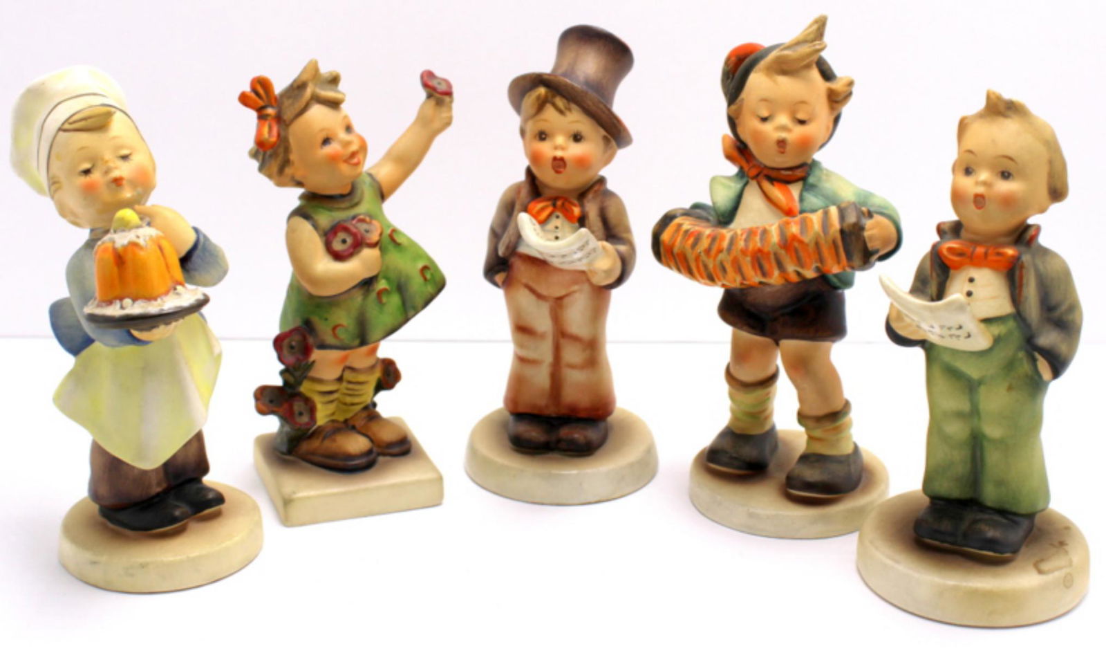 Five Goebel Hummel Figurines: Five Goebel Hummel figurines includes street singer, accordion boy, baker, spring cheer and soloist boy singing measures 5" x 5 1/2" High