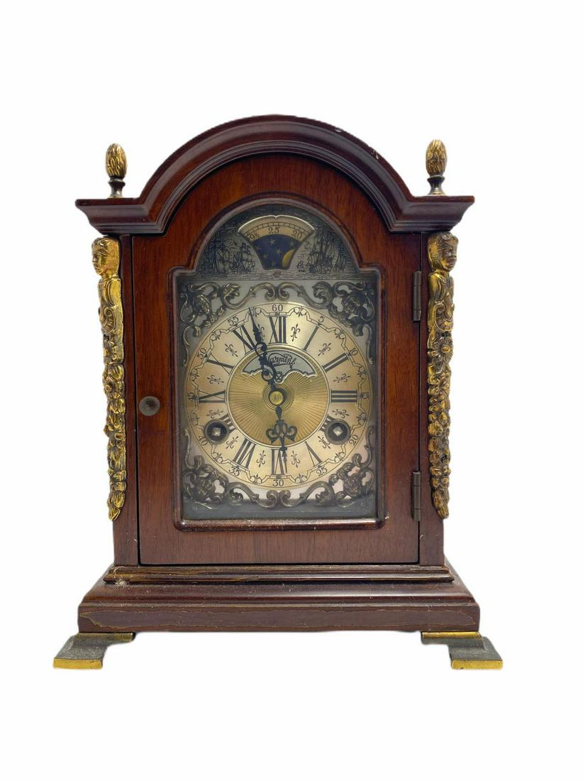 John Warmink Bracket Clock in Ornate Wood Case: John Warmink bracket clock in ornate wood case with roman numerals Wuba two jewel west German works measures 10" H x 7" L x 5 1/2" W