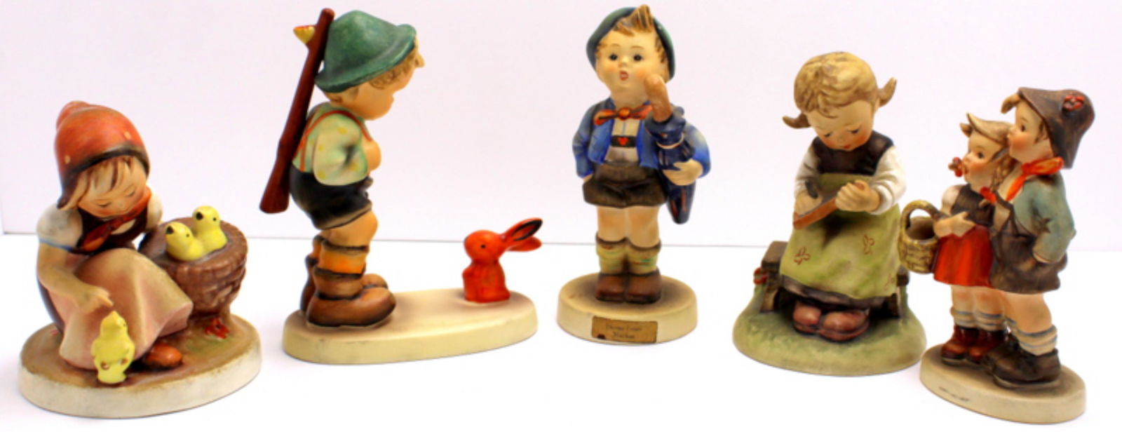 Five Goebel Hummel Figurines: Five Goebel Hummel figurines includes sensitive hunter, home from market, busy student, chick girl and surprise measures 4 3/4" x 4" High