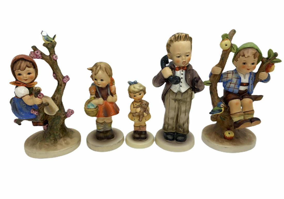 Six Hummel Goebel Figurines: Six Hummel Goebel Figurines includes apple tree boy and girl measures 6" H, Hello measures 5 7/8" H, school girl measures 4 1/2" H and cuddles measures 3 1/2" H