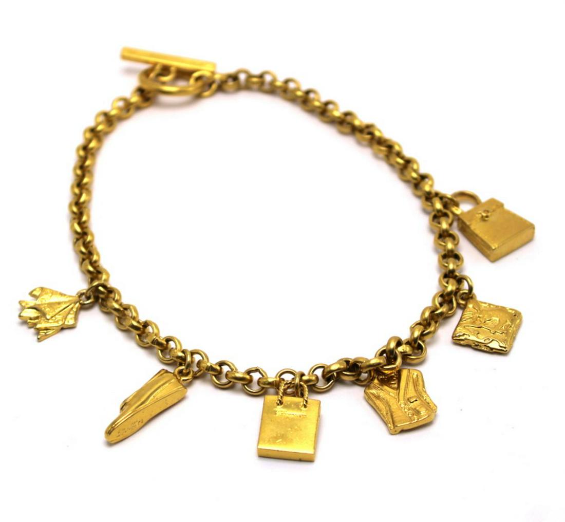 Salvatore Ferragamo Charm Gold Filled Necklace: Salvatore Ferragamo charm gold filled necklace measures approx 7" long
