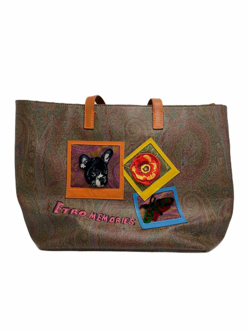 Etro, Milan, Italy Memories Tote Special Edition: Etro, Milan, Italy Memories Tote Special Edition Paisley Print. Burnt Orange handles. Fabric Interior with Etro Logo. Goldtone hardware with zip closure measures 17" L x 12" H x 6 1/4" W. Comes with E
