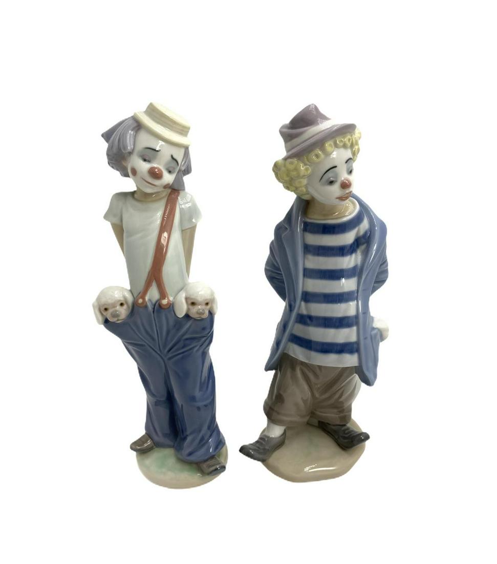 Two Lladro Porcelain Figurines: Two Lladro Porcelain Figurines includes #7602 little traveler and little pals measures 9" High