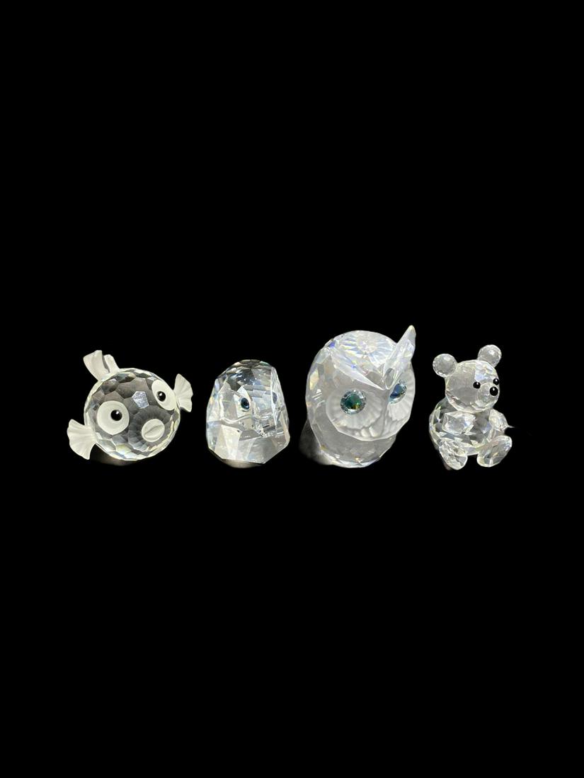 Four Pcs Swarovski Crystal Figurines: Four Pcs Swarovski Crystal Figurines includes owl measures Height: 2 1/2", eagle head measures Height: 1 3/4", fish measures Height: 1 5/8" and bear measures Height: 1 7/8"