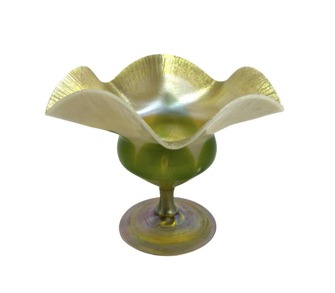 Signed L.C. Tiffany Favrile Floriforn Compote in Opal: Signed L.C. Tiffany Favrile Floriforn Compote in Opal Glass with Green Pulled Feather Decor Iridescent Gold Interior and Gold Disk Foot signed 1877 E L.C. Tiffany Favrile and sticker on bottom measure