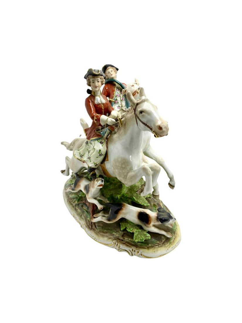 Capodimonte Porcelain Figural Fox Hunt Grouping of a: Capodimonte Porcelain Figural Fox Hunt Grouping of a Fox Hunt Scene with Couple on Horseback with Hounds measures Height: 12" x Length: 14"